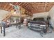 A large garage with exposed wooden beams and plenty of space for vehicles, storage, and projects at 6686 Se 135Th St, Summerfield, FL 34491