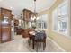 Eat-in kitchen area features tiled floors, chair railing, and lots of natural light at 6686 Se 135Th St, Summerfield, FL 34491