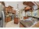Spacious kitchen with granite countertops, center island and stainless steel appliances at 6686 Se 135Th St, Summerfield, FL 34491