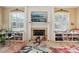 The living room features a fireplace, mantel with decorative corbels and built-in bookcases at 6686 Se 135Th St, Summerfield, FL 34491