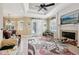 The open-concept living room features a fireplace, tile flooring, and access to the outdoors at 6686 Se 135Th St, Summerfield, FL 34491