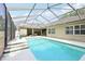 Inviting screened-in pool with steps, ideal for relaxation and entertaining friends and Gathering at 6686 Se 135Th St, Summerfield, FL 34491