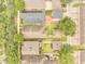 Aerial shot shows solar panels and neighborhood layout with tree coverage at 6837 Pasturelands Pl, Winter Garden, FL 34787
