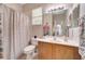 Bathroom features a wood vanity, bright lights, and shower at 6837 Pasturelands Pl, Winter Garden, FL 34787