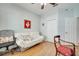 Bright bedroom with light blue walls, a futon couch, and closet at 6837 Pasturelands Pl, Winter Garden, FL 34787