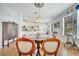 Spacious dining room with hardwood floors leading to the kitchen with an open floor plan concept at 6837 Pasturelands Pl, Winter Garden, FL 34787