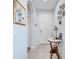 Entryway featuring a bright white door, elegant tile flooring, and decorative wall accents at 6837 Pasturelands Pl, Winter Garden, FL 34787