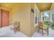Cozy front porch showcasing comfortable seating, house number, and inviting curb appeal at 6837 Pasturelands Pl, Winter Garden, FL 34787