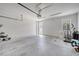 Spacious garage with white block walls and plenty of natural light at 6837 Pasturelands Pl, Winter Garden, FL 34787