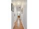 Hallway with an arched ceiling and a view of the bathroom at 6837 Pasturelands Pl, Winter Garden, FL 34787