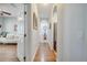 Bright hallway with arched doorways and hardwood flooring, leading to the living spaces at 6837 Pasturelands Pl, Winter Garden, FL 34787