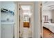 Hallway leads to the laundry room, bathroom, and bedroom at 6837 Pasturelands Pl, Winter Garden, FL 34787