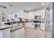 Bright kitchen boasting stainless steel appliances, tile floors, and plenty of counter space at 6837 Pasturelands Pl, Winter Garden, FL 34787