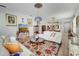 Bright living room with an open floor plan, decorative ceiling fixtures and a colorful area rug at 6837 Pasturelands Pl, Winter Garden, FL 34787