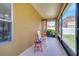 Covered patio with rocking chairs and relaxing atmosphere at 6837 Pasturelands Pl, Winter Garden, FL 34787