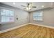 Empty bedroom featuring wood-style floors, natural light, and a ceiling fan at 731 Guernsey St, Orlando, FL 32804