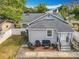 Aerial view of a cozy home and fenced yard with patio furniture on a brick patio at 731 Guernsey St, Orlando, FL 32804