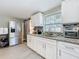 Renovated kitchen featuring granite counters, white cabinets, and stainless appliances at 731 Guernsey St, Orlando, FL 32804