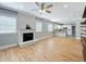 Hardwood floors throughout this open living room with view of the kitchen and fireplace at 731 Guernsey St, Orlando, FL 32804