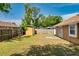 Well-maintained backyard featuring lush green grass and providing ample space for entertainment at 7616 Southwick St, Orlando, FL 32818