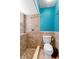 Tiled shower stall and toilet, neutral colors and silver shower fixture in bathroom at 7616 Southwick St, Orlando, FL 32818