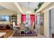 Elegant dining area with stylish furnishings, natural light, and a decorative china cabinet, perfect for Gathering gatherings at 7616 Southwick St, Orlando, FL 32818