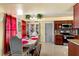 Charming dining area with views from the window, with stylish furnishings and decor, creating a warm atmosphere at 7616 Southwick St, Orlando, FL 32818