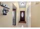 Inviting entryway featuring tile flooring, stylish decor, and a convenient coat closet, creating a welcoming atmosphere at 7616 Southwick St, Orlando, FL 32818