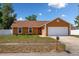 Charming single-story home with a well-manicured lawn and a two-car garage, perfect for suburban living at 7616 Southwick St, Orlando, FL 32818