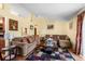 Spacious living room with hardwood floors, plenty of natural light, and comfortable seating, creating a comfortable atmosphere at 7616 Southwick St, Orlando, FL 32818