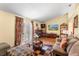 Bright living room with access to a deck, fireplace, and stylish decor, creating a cozy and inviting space at 7616 Southwick St, Orlando, FL 32818