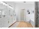 Bright bathroom boasts a double vanity with modern fixtures and a separate tub at 811 Wayne Ave, Altamonte Springs, FL 32701