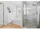 Bathroom features a glass-enclosed shower with marble tile and a soaking tub at 811 Wayne Ave, Altamonte Springs, FL 32701
