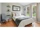 Cozy bedroom provides natural light, wood floors, and a serene atmosphere at 811 Wayne Ave, Altamonte Springs, FL 32701