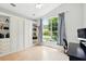 Bedroom featuring built-in shelves and a large window with tree views at 811 Wayne Ave, Altamonte Springs, FL 32701