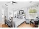 Comfortable bedroom features a ceiling fan, natural light, and a neutral color palette at 811 Wayne Ave, Altamonte Springs, FL 32701