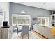 Charming dining area with a round table, bay window, and adjacent living room, perfect for Gathering meals at 811 Wayne Ave, Altamonte Springs, FL 32701