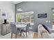 Cozy dining area with a bay window, seating, and views of the backyard, offering a warm ambiance at 811 Wayne Ave, Altamonte Springs, FL 32701