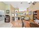 Open concept dining room featuring hardwood floors and a view of the fireplace and living area at 811 Wayne Ave, Altamonte Springs, FL 32701