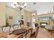 Dining area showcases hardwood floors, stylish chairs, and an open layout with views to other living spaces at 811 Wayne Ave, Altamonte Springs, FL 32701