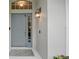 Stylish front door featuring decorative glass, a modern lantern, and a welcoming entrance mat at 811 Wayne Ave, Altamonte Springs, FL 32701