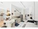 Bright kitchen featuring white cabinets, tile countertops, stainless steel appliances, and recessed lighting at 811 Wayne Ave, Altamonte Springs, FL 32701