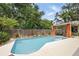 Private pool with a covered patio area and beautiful landscaping at 811 Wayne Ave, Altamonte Springs, FL 32701