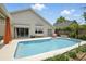 Backyard swimming pool offers a refreshing escape with its clean lines and ample lounging space at 811 Wayne Ave, Altamonte Springs, FL 32701