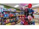 Interior view of a bright convenience store with shelves of snacks and souvenirs at 8941 Bismarck Palm Rd, Kissimmee, FL 34747