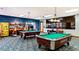 Spacious game room with pool tables, arcade games, and comfortable atmosphere at 8941 Bismarck Palm Rd, Kissimmee, FL 34747