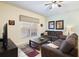 Relaxing living room boasts neutral tones, plush seating, ceiling fan and ample natural light at 8941 Bismarck Palm Rd, Kissimmee, FL 34747