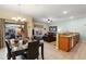 Open-concept living space includes a dining area and modern kitchen with granite countertops at 8941 Bismarck Palm Rd, Kissimmee, FL 34747
