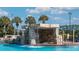 Relaxing community pool with an impressive rock waterfall feature at 8941 Bismarck Palm Rd, Kissimmee, FL 34747