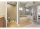 Elegant bathroom with a garden tub and separate shower at 10161 Sandy Marsh Ln, Orlando, FL 32832